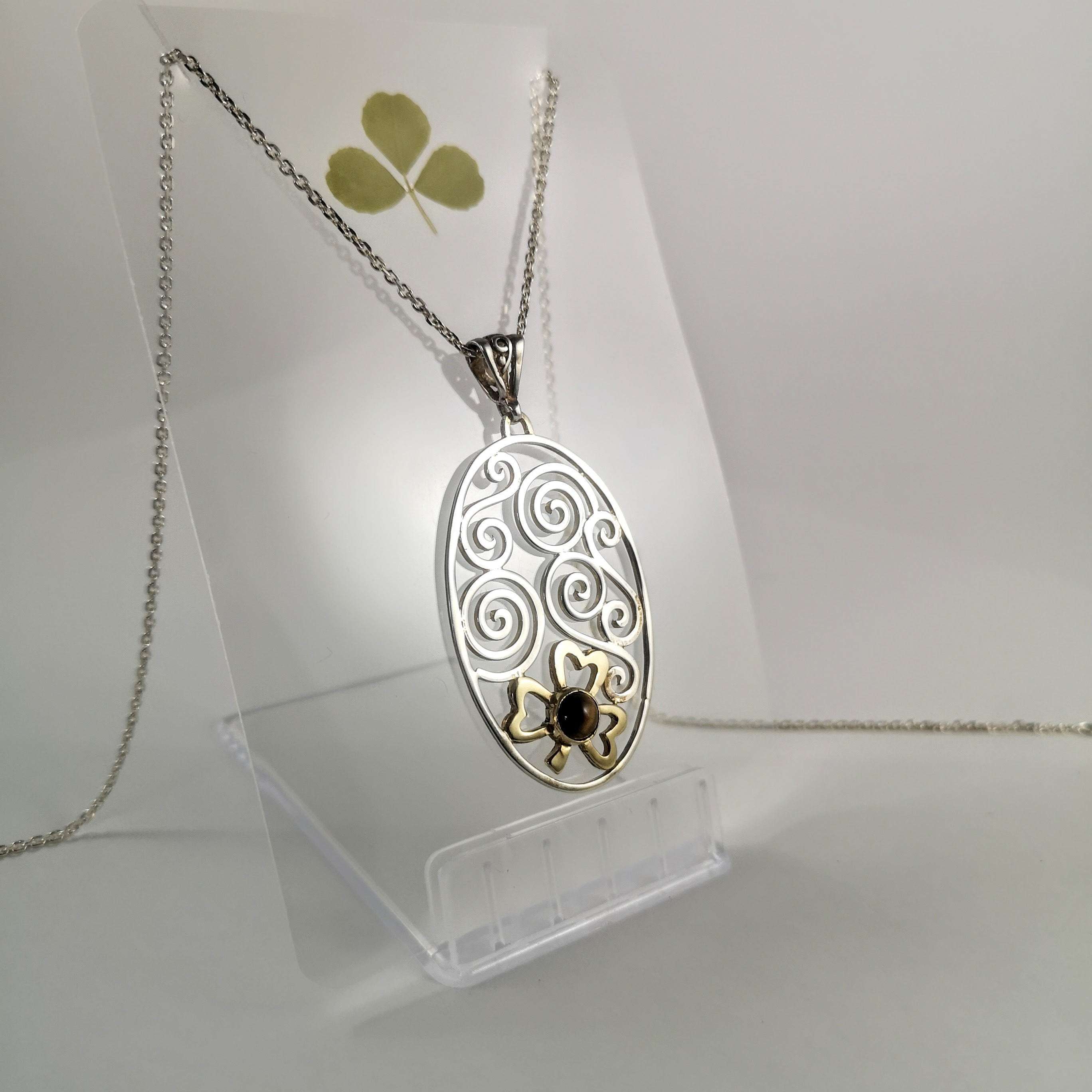 Celtic Combinations Sterling Silver Spiral Pendant with 9ct Gold Shamrock with Tigers EyeEye Stone Setting