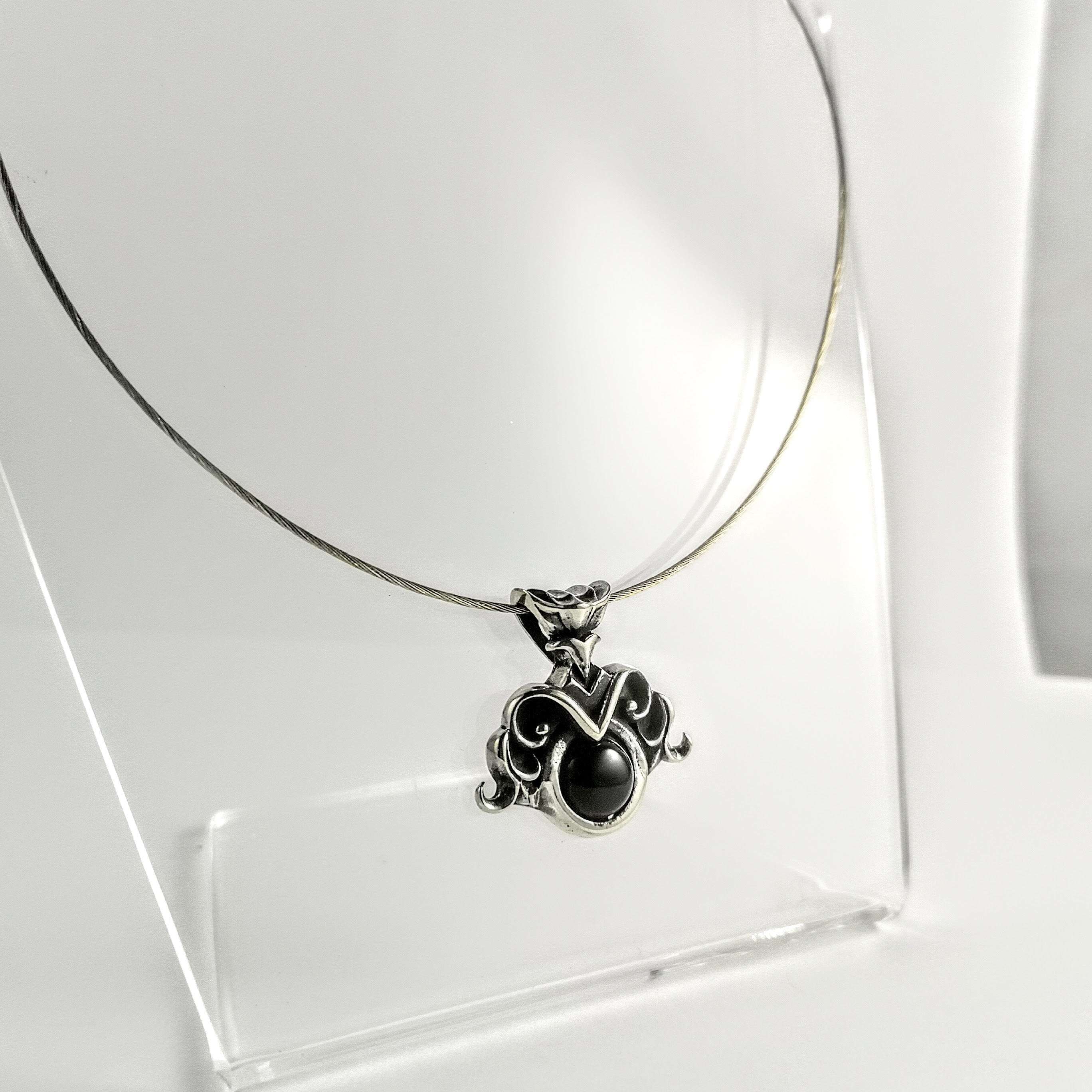 Endearing Sterling Silver Ornate Pendant with Black Onyx Stone