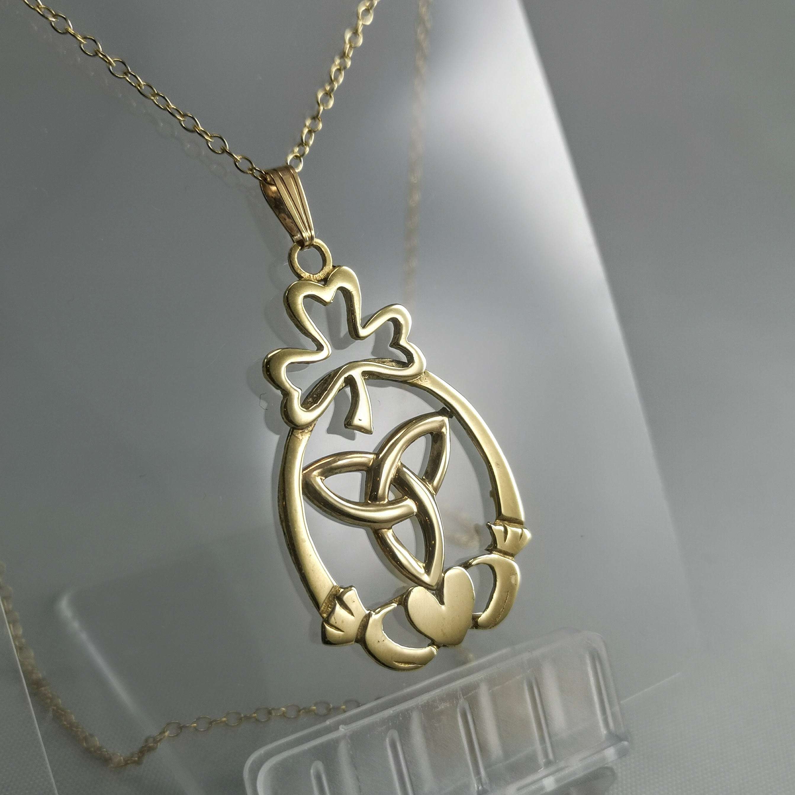 9ct gold Irish celtic claddagh, shamrock and trinity knot heavy pendant on an 18" gold chain